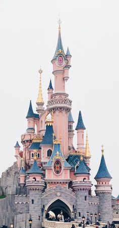 the castle is pink and blue with gold trim