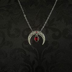 "This simple pendant features a richly detailed antiqued silver tone crescent, adorned with dazzling dark ruby red glass crystals. Pendant is 1 1/8\" wide and 1\" tall.  Necklace length is adjustable with soldered stainless steel cable chain, lobster clasp and extender. If you would like a different length, please send us a message. Matching headpiece, pendant and earrings are listed separately in our store. If you don't see items with a color you want, feel free to ask about availability." Red Moon Necklace, Goth Necklace, Triple Moon Goddess, Goth Wedding, Filigree Necklaces, Goth Jewelry, Choker Pendant, Triple Moon, Funky Jewelry