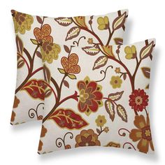 two decorative pillows with floral designs on them