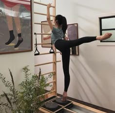 a woman standing on top of a balance board