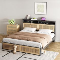 a dog is sitting on the floor in front of a bed with wicker headboard and foot board