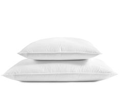 two white pillows stacked on top of each other