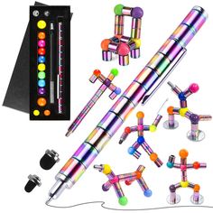 an assortment of different colored objects including pens and magnets on a white background with a black box