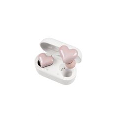 two pink heart shaped earphones sitting on top of an electronic device's case