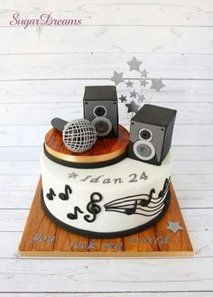 a cake with speakers and music notes on it