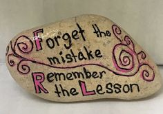 a rock with writing on it that says forget the miske, remember the lesson