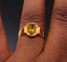 Traditional style handmade 22karat yellow gold gorgeous colorl stone handmade tribal ring band jewelry from rajasthan india. weight- 7.190 grams approx. width-11 mm maximum. metal-yellow gold. metal purity- 22 karat. brand-handmade. Stone-sunela stone(citrine)  marking- 916 stamp. size-select size. weight of ring may be increase or decrease according to size. note-gold jewelry is handmade designer jewelry . so there can be slight difference in size and weight of the article in the comparison of Hand-set 22k Gold Jewelry For Anniversary, Yellow Gemstone Ring Jewelry, Yellow 22k Gold Jewelry For Wedding, Yellow 22k Gold Wedding Jewelry, Yellow Topaz Ring Jewelry, Traditional Yellow Hallmarked Jewelry, 22k Gold Rings With Gemstone, Yellow 22k Gold Temple Jewelry, Gold Rings With Gemstones