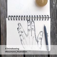 a drawing of two hands on top of a notebook next to a pen