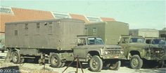 two army trucks parked next to each other