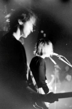 black and white photograph of two people on stage