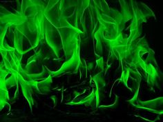 green fire flames on a black background