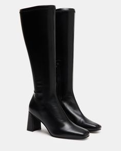 A half-zipper closure gives the HOLLY knee boot a calf-defining fit while an angled block heel and a square toe giving this style a sharp finish. Square toe block heel knee boot Side half zipper closure Angled block heel 2.75 inch heel height Size 6 measurements: 12 inch shaft circumference, 14.25 inch shaft height Size 8 measurements: 14.5 inch shaft circumference, 15.5 inch shaft circumference Size 10 measurements: 15 inch shaft circumference, 16 inch shaft height Vegan leather upper material Steve Madden Black Boots, Kitten Heel Slingbacks, Steve Madden Store, Boots Square Toe, Steve Madden Boots, Wedge Loafers, Black Knee High Boots, Holly Black, Exclusive Shoes