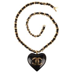 Chanel - (Made in France) Golden metal necklace with black leather and a wood heart topped with a cc logo. Spring-Summer 1992 Collection. Additional information: Condition: Very good condition Dimensions: Length: 76 cm Period: 20th Century Seller Reference: CB186 Heart Accessories, Metal Necklace, Heart Top, Wood Hearts, Chanel Black, Black Ribbon, Cc Logo, A Wood, Metal Necklaces