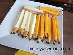 five pieces of cheese are lined up on a cutting board with the words food diary written above them