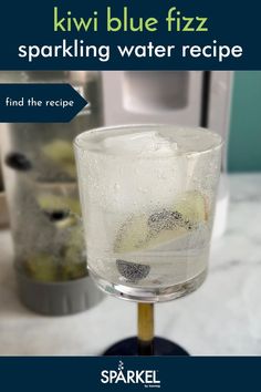 a glass filled with liquid sitting on top of a counter