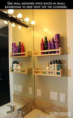 a bathroom mirror with shelves filled with hair products