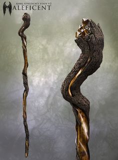 an artistic piece of art that looks like a twisted tree branch with gold highlights on it