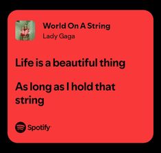 a red square with the words, world on a string lady gaga life is a beautiful thing as long as i hold that string