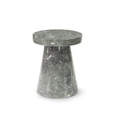 a grey marble table sitting on top of a white floor