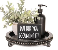 a sign that says but did you document it? next to a potted plant