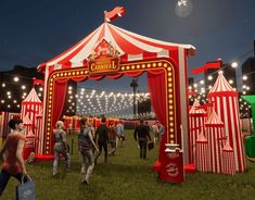 people are walking around in front of a circus tent with red and white striped tents