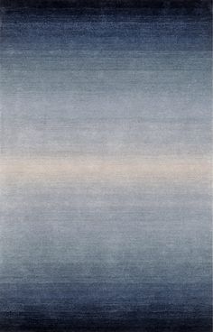 an area rug with blue and beige tones