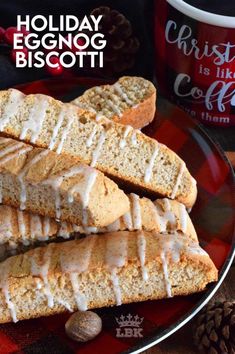 three slices of eggnog biscotti on a plate next to a cup of coffee