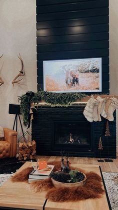 the living room is decorated for christmas with deer heads on the fireplace mantels