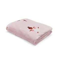 a pink blanket with brown and white flowers on it, sitting on top of a white surface