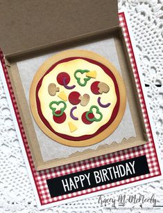 a birthday card with an image of a pizza in a box on top of a table