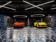 two yellow and red sports cars parked in a parking garage with graffiti on the walls