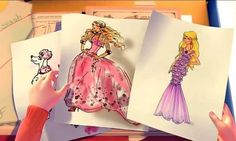 two children's hands are drawing barbie paper dolls