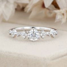 a white gold engagement ring with diamonds on it