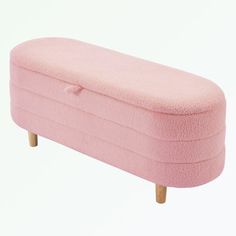 an upholstered pink bench with wooden legs and footrests, on a white background