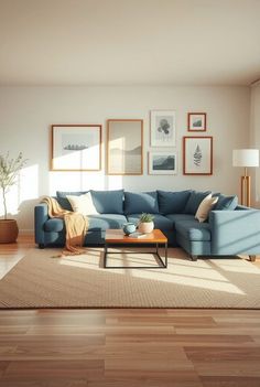 a living room with wood flooring and blue couches in the middle of it