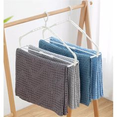 three towels are hanging on a clothes rack