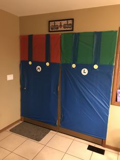 a room with two doors decorated like mario and luigi