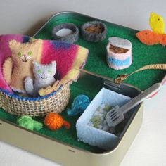 there is a tin with some stuff animals in it