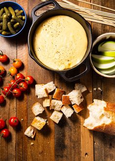 the best - ever cheese fondue is made with fresh bread, tomatoes and pickles