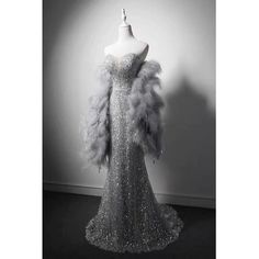 This stunning Grey Beaded Mermaid Formal Dress With Feather Shawl is perfect for any special occasion. The exquisite beading and intricate detailing on the bodice will make you feel like a princess. The full skirt flares out from the waist and is lined with a layer of feathers, creating an elegant and luxurious look. The feather shawl has a soft and textured feel and adds a touch of glamour to the look. The dress is available in plus size and is sure to make you the belle of the ball. Polka Dot Wedding Dress, Feather Shawl, Fashion Documentaries, Feather Prom Dress, Beaded Mermaid, Dress With Shawl, Polka Dot Wedding, Feather Dress, Ball Gown Dresses