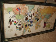 a map with many different items hanging on it's sides and around the world