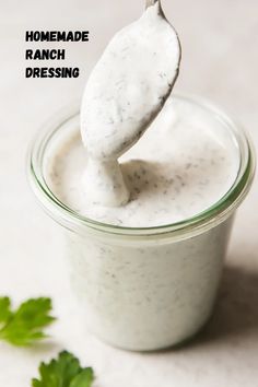 a spoon full of ranch dressing with parsley