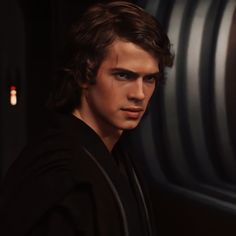 a young man in a star wars movie is looking at the camera with an intense look on his face