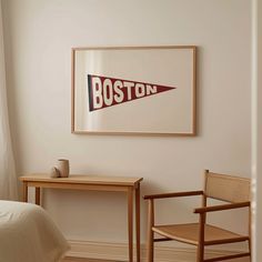 a bedroom with a bed, desk and chair next to a painting on the wall