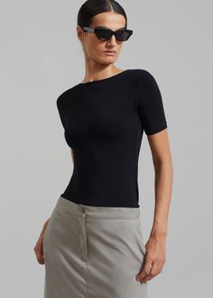 Color: Black Lightweight fluid fabric with stretch Relaxed fit Boat neck Low rounded back Short sleeves Slip on style Unlined 96% Rayon 4% Elastane Machine Wash Cold By The Frankie Shop. Imported The Frankie Shop, Frankie Shop, Back Shirt, Boat Neck, Black Shirt, Style Me, Short Sleeves, Slip On, Relaxed Fit