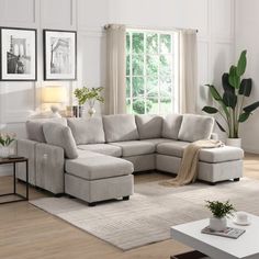 a living room with a sectional couch and coffee table