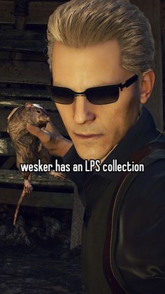 a man with sunglasses and a rat on his arm