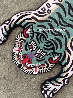 an animal rug with a tiger on it's face and the words modern carpet