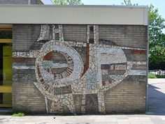 a brick wall with an elephant painted on it