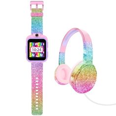 a colorful watch and headphones are next to each other